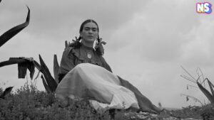 Frida Kahlo, seated next to an agave plant, from a 1937 photo shoot for Vogue entitled "Señoras of Mexico."
